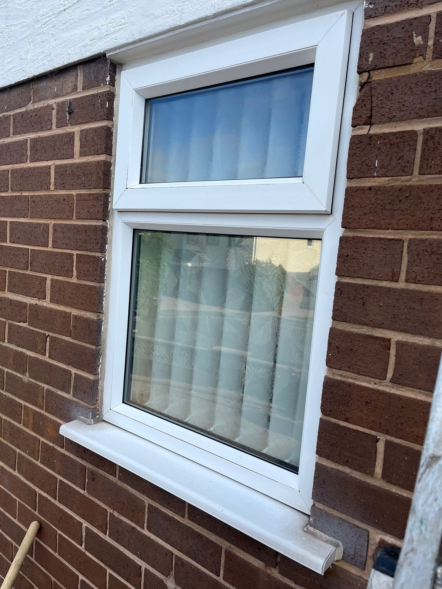 Before UPVC frame cleaning showing dirt and grime on windows and doors